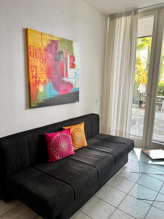 Posezení v ubytování Wohnung mit Aussicht auf Lago Maggiore & Pool