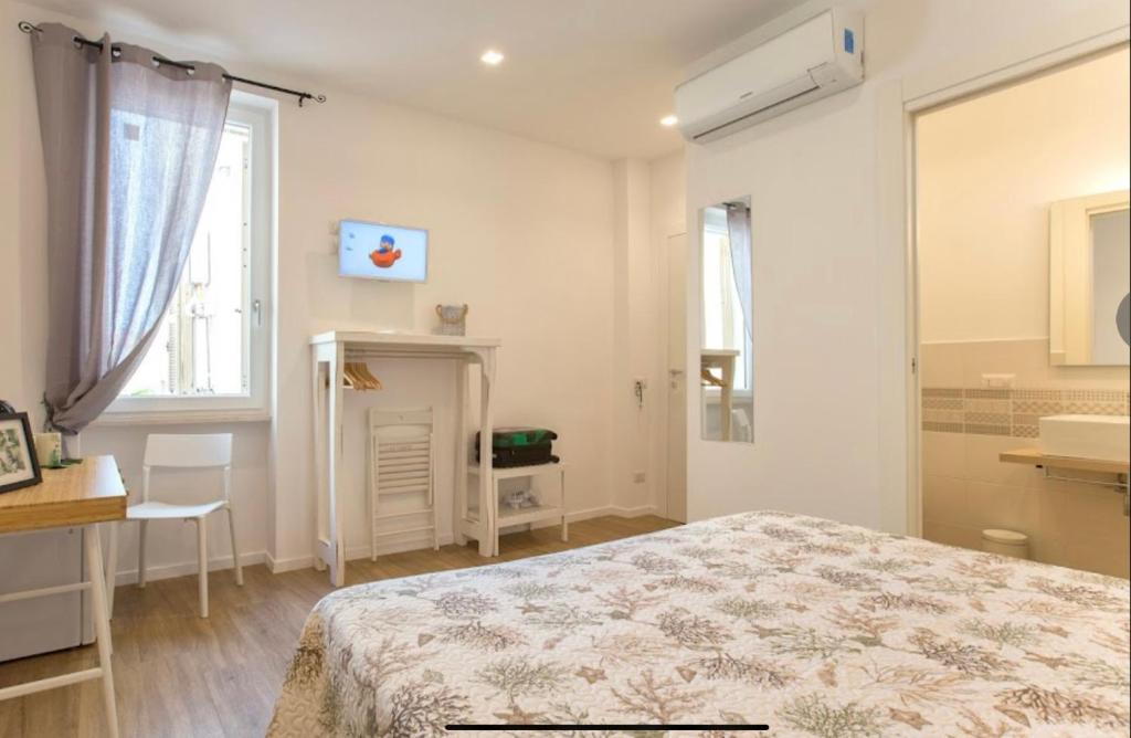 Postel nebo postele na pokoji v ubytování Catalogna10 Rooms