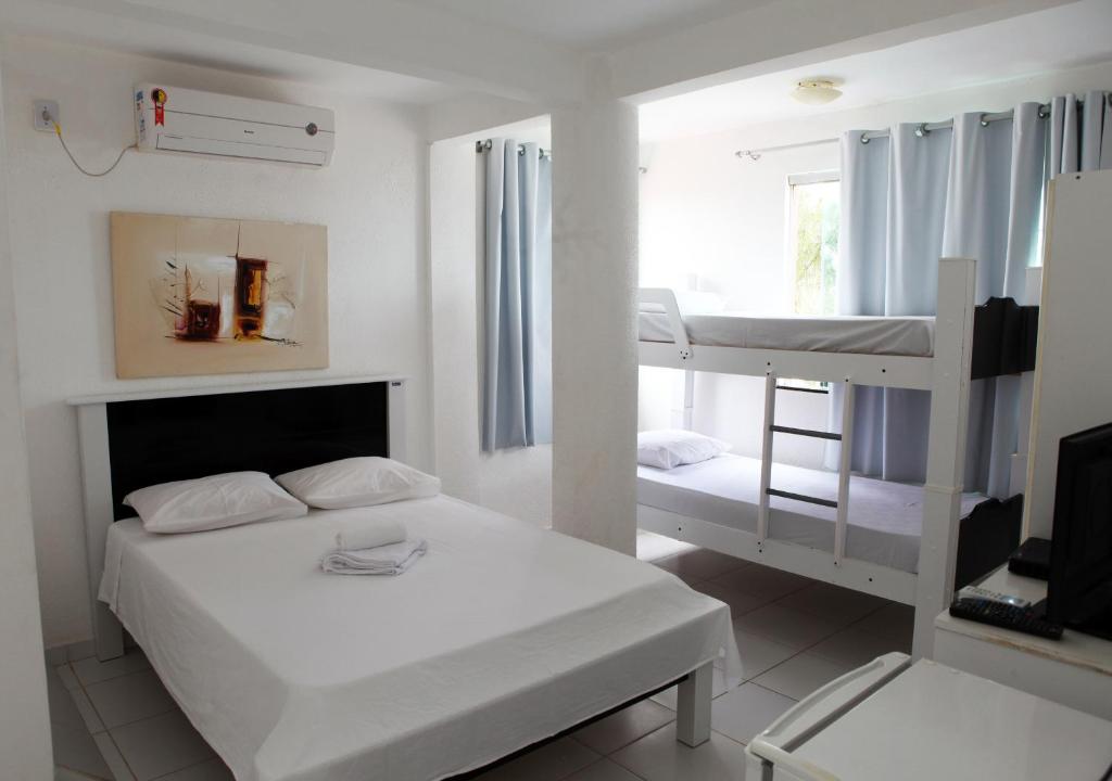 Postel nebo postele na pokoji v ubytování Hotel Pousada Oasis