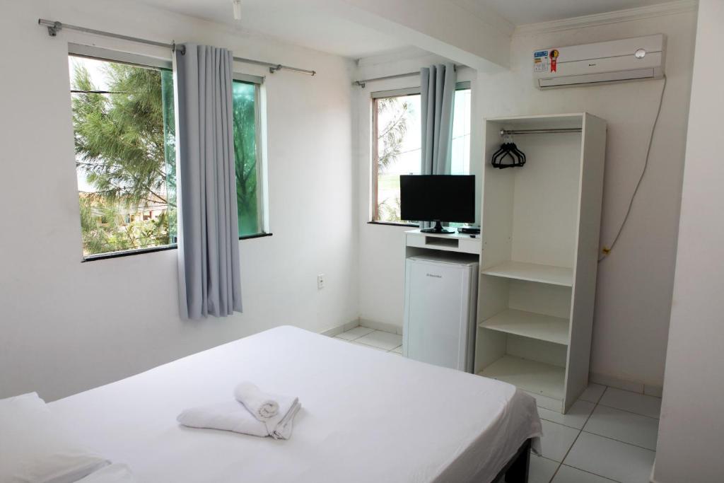 Postel nebo postele na pokoji v ubytování Hotel Pousada Oasis