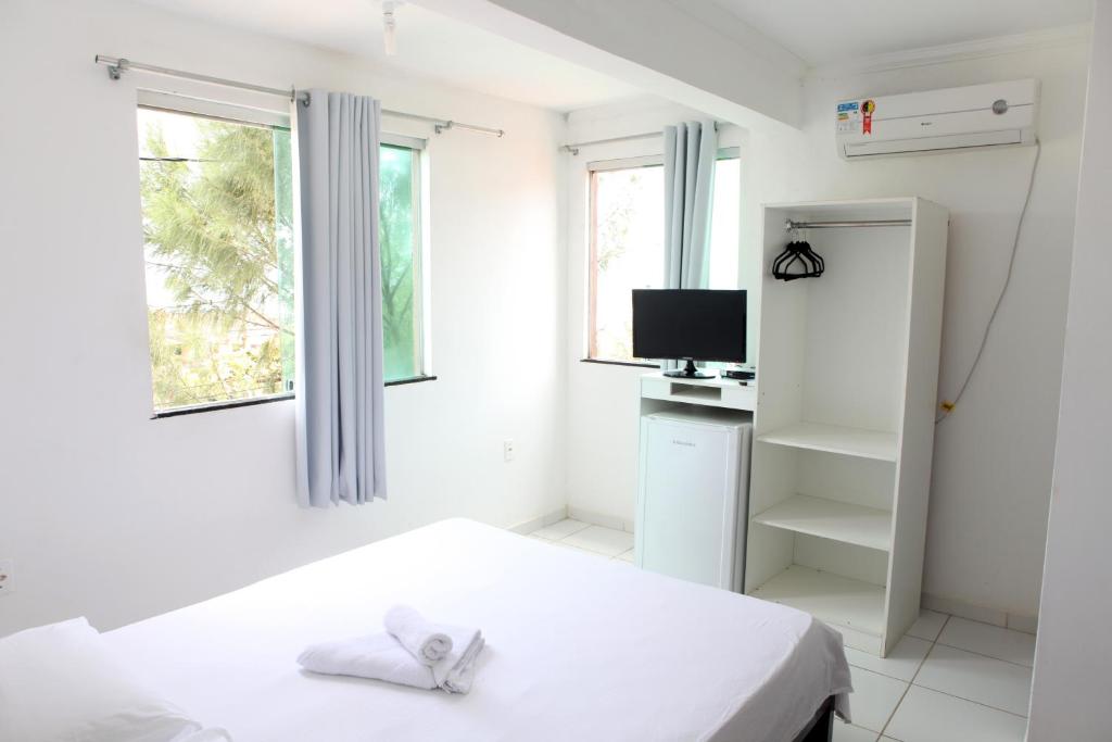 Postel nebo postele na pokoji v ubytování Hotel Pousada Oasis