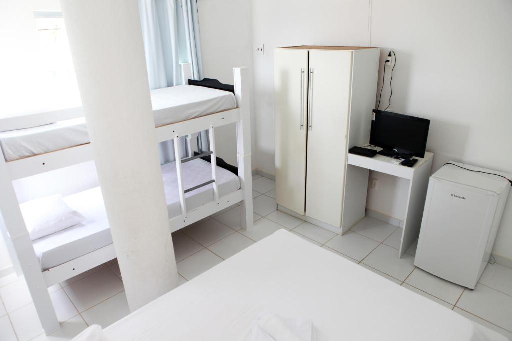 Postel nebo postele na pokoji v ubytování Hotel Pousada Oasis