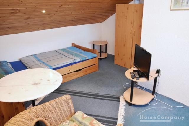 Postel nebo postele na pokoji v ubytování GARNI