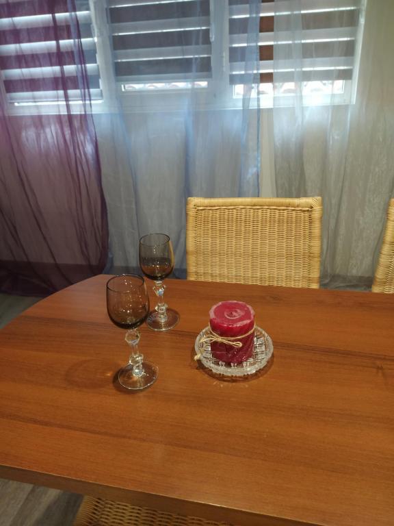 a table with two glasses and a bowl on it at AA21 in Yerevan
