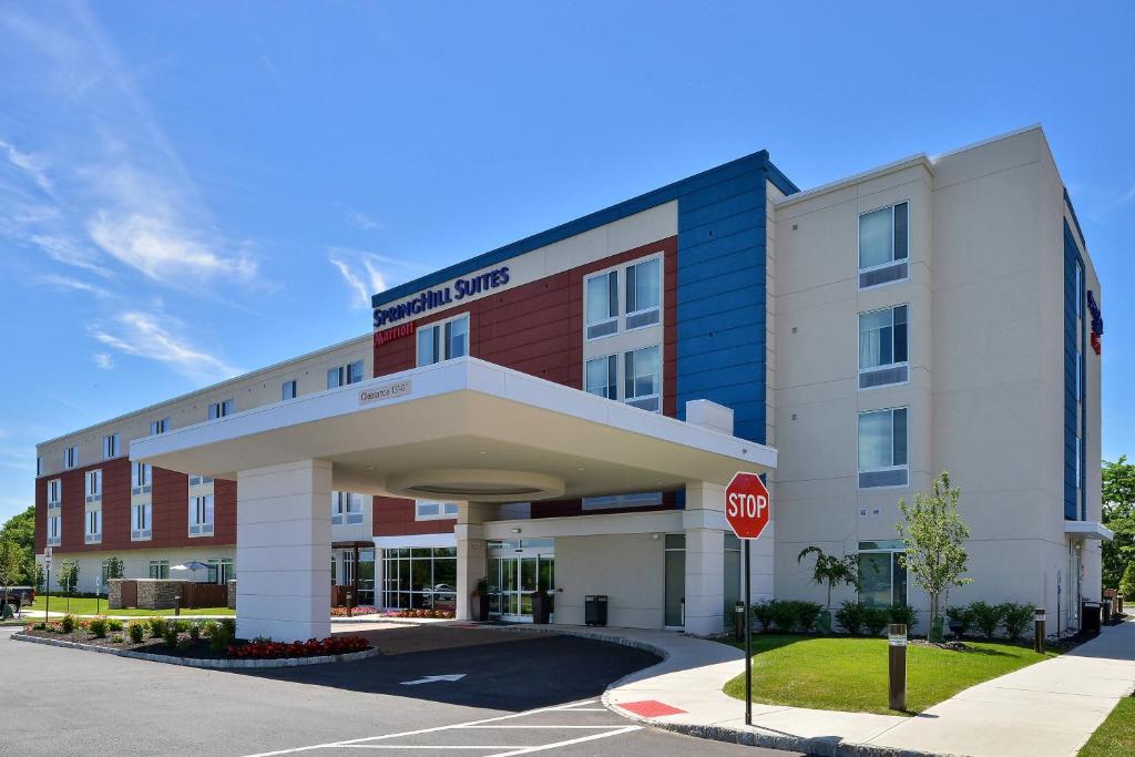 a hotel building with a stop sign in front of it at SpringHill Suites by Marriott Voorhees Mt. Laurel/Cherry Hill in Voorhees