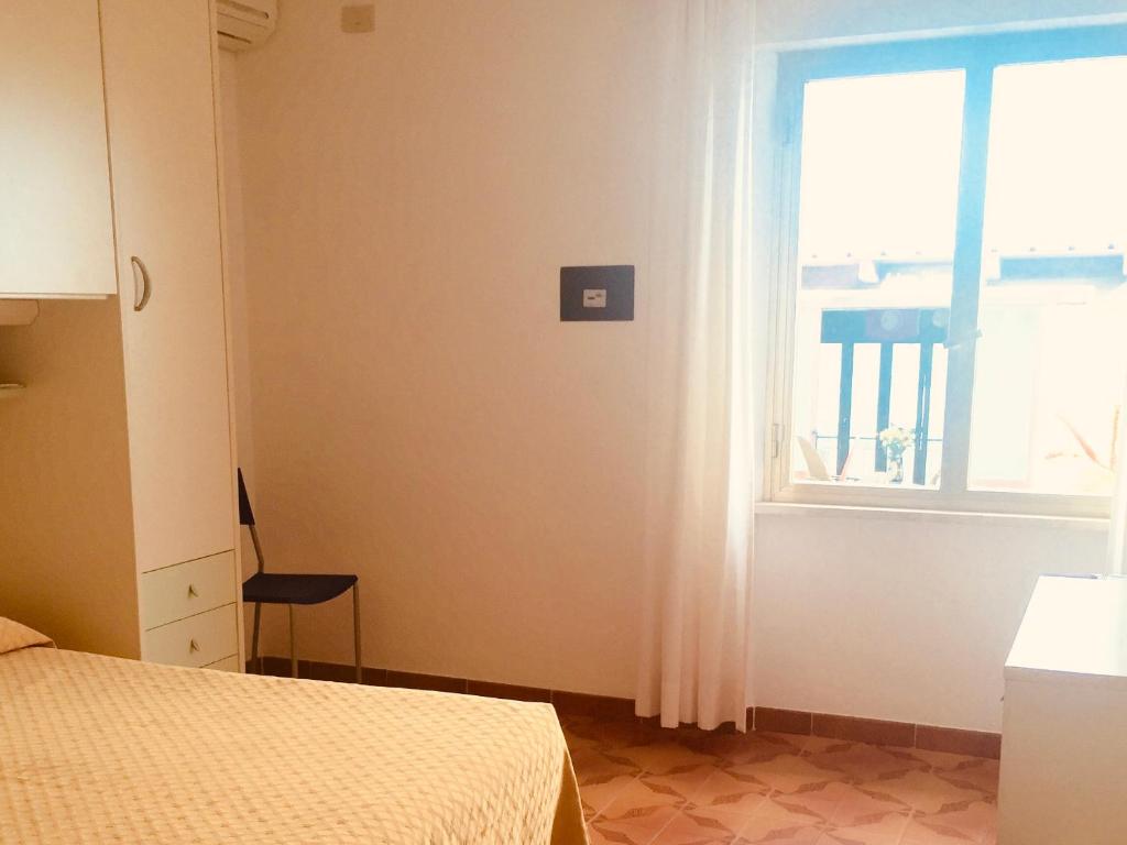 Ein Bett oder Betten in einem Zimmer der Unterkunft Hotel La Stella
