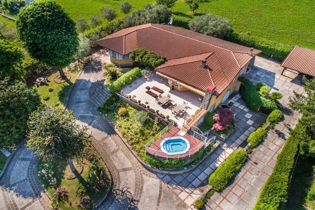 an overhead view of a house with a swimming pool at Villa Luce-Casa vacanza con vista panoramica mare. in Velletri