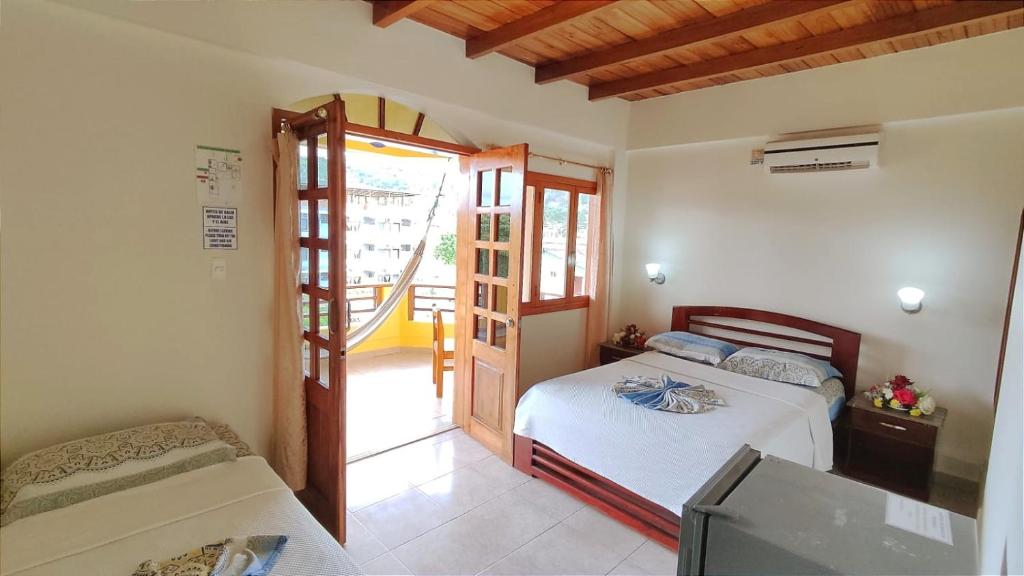 Postel nebo postele na pokoji v ubytování Hotel Cielo Azul
