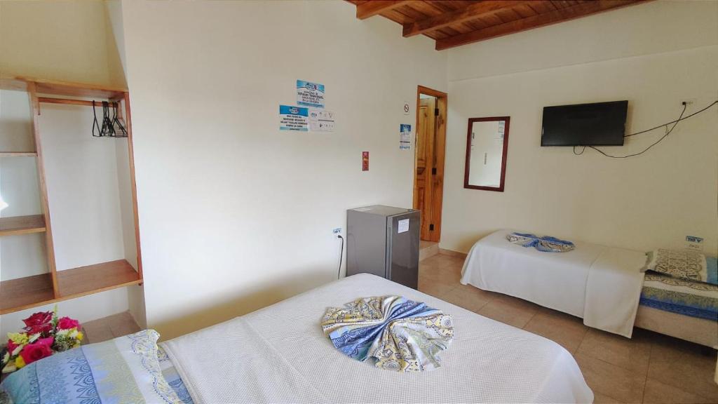 Postel nebo postele na pokoji v ubytování Hotel Cielo Azul