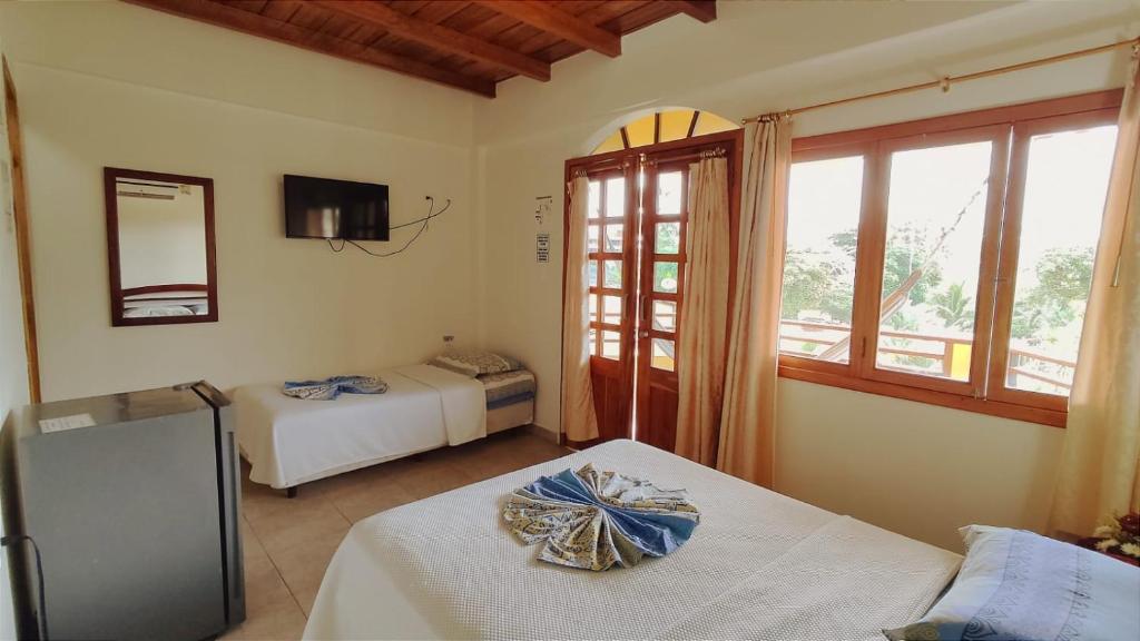 Postel nebo postele na pokoji v ubytování Hotel Cielo Azul