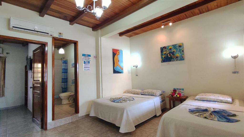 Postel nebo postele na pokoji v ubytování Hotel Cielo Azul