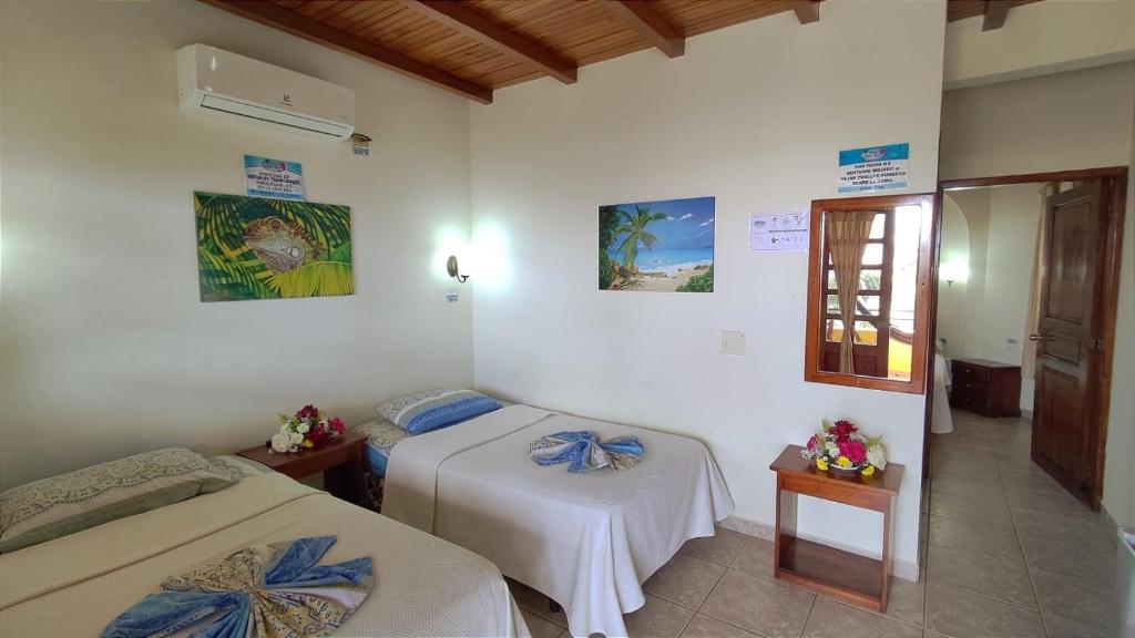 Postel nebo postele na pokoji v ubytování Hotel Cielo Azul