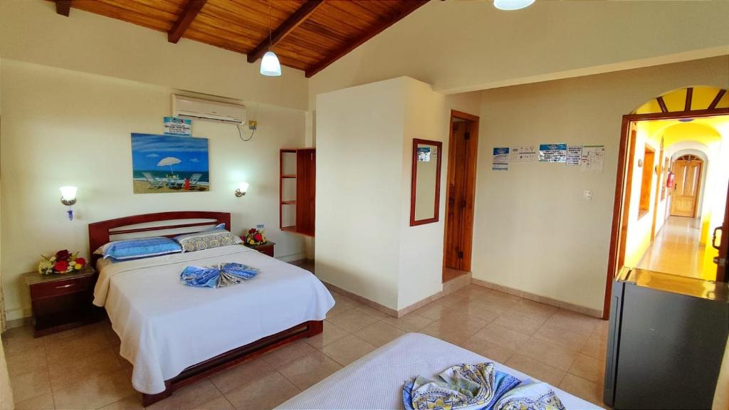 Postel nebo postele na pokoji v ubytování Hotel Cielo Azul