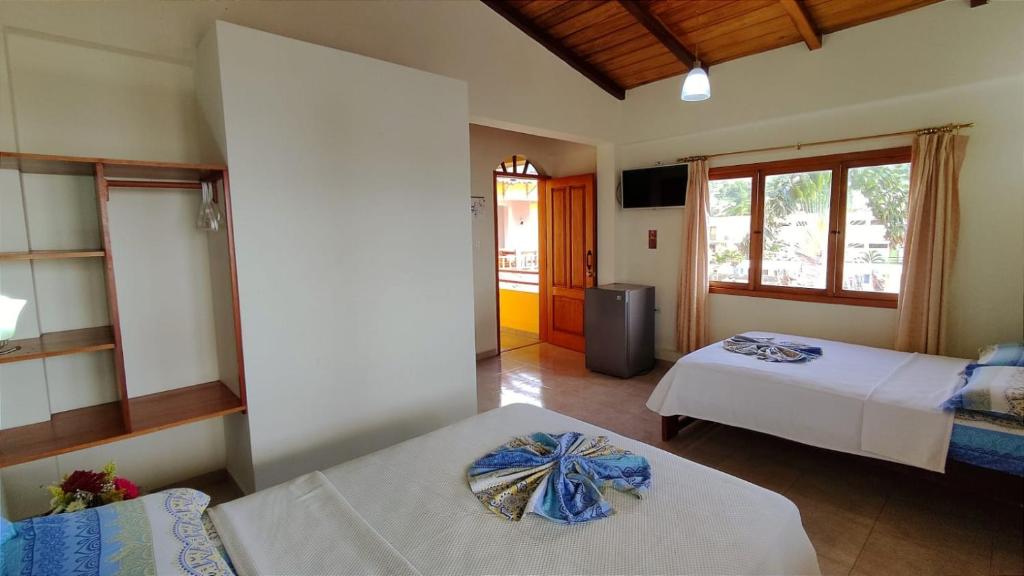 Postel nebo postele na pokoji v ubytování Hotel Cielo Azul