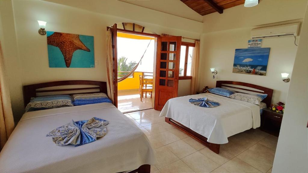 Postel nebo postele na pokoji v ubytování Hotel Cielo Azul