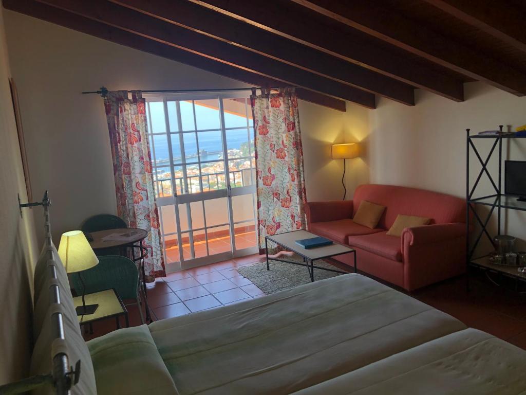 Postel nebo postele na pokoji v ubytování Apartamentos Quinta Mae dos Homens