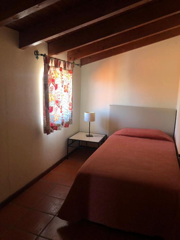 Postel nebo postele na pokoji v ubytování Apartamentos Quinta Mae dos Homens