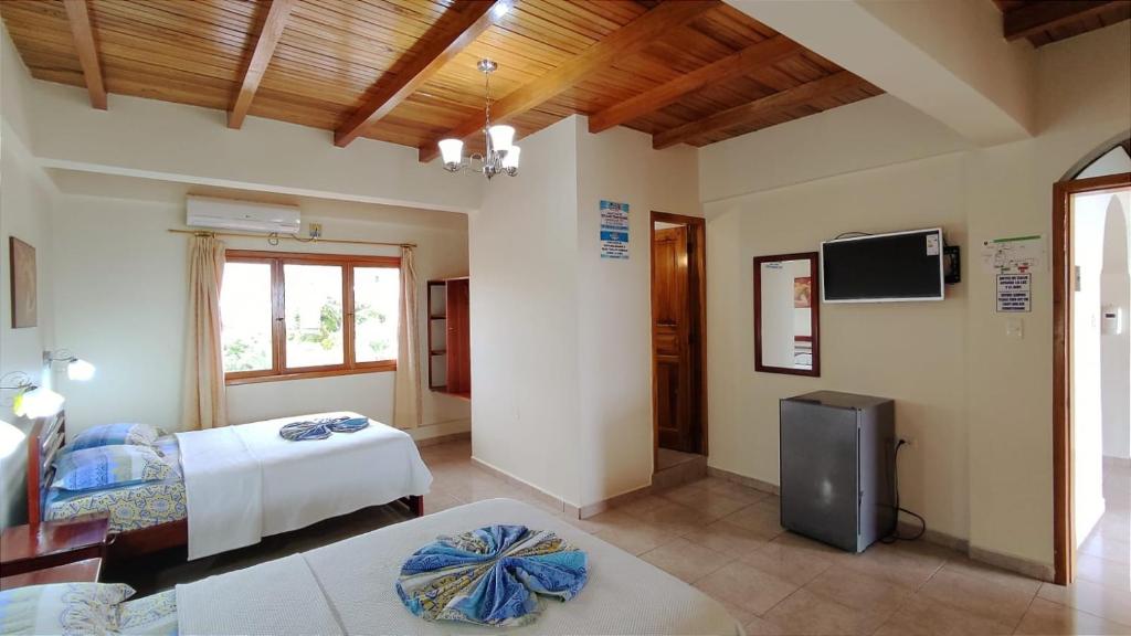 TV a/nebo společenská místnost v ubytování Hotel Cielo Azul