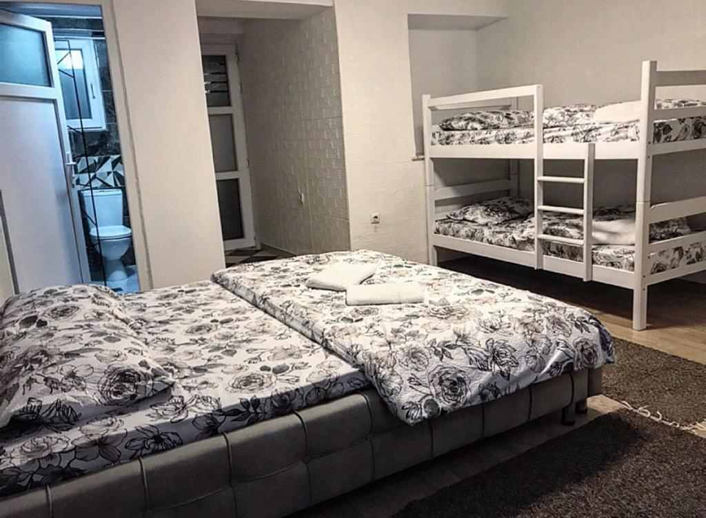 a room with two bunk beds and a bedvisor at APARTMENT Marash in Prizren