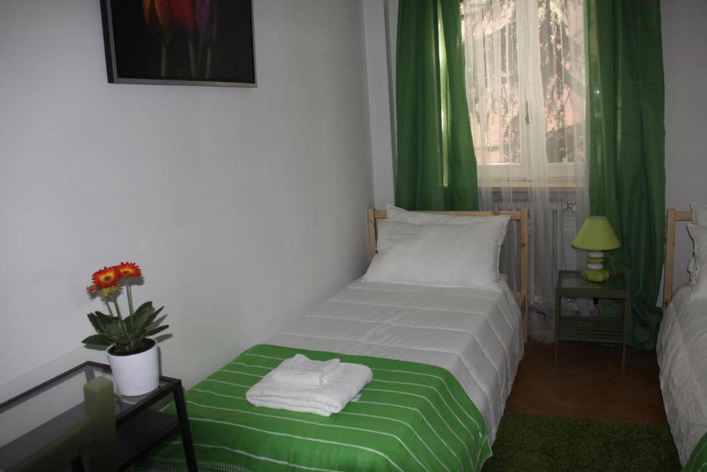 Postel nebo postele na pokoji v ubytování Lotus B&B