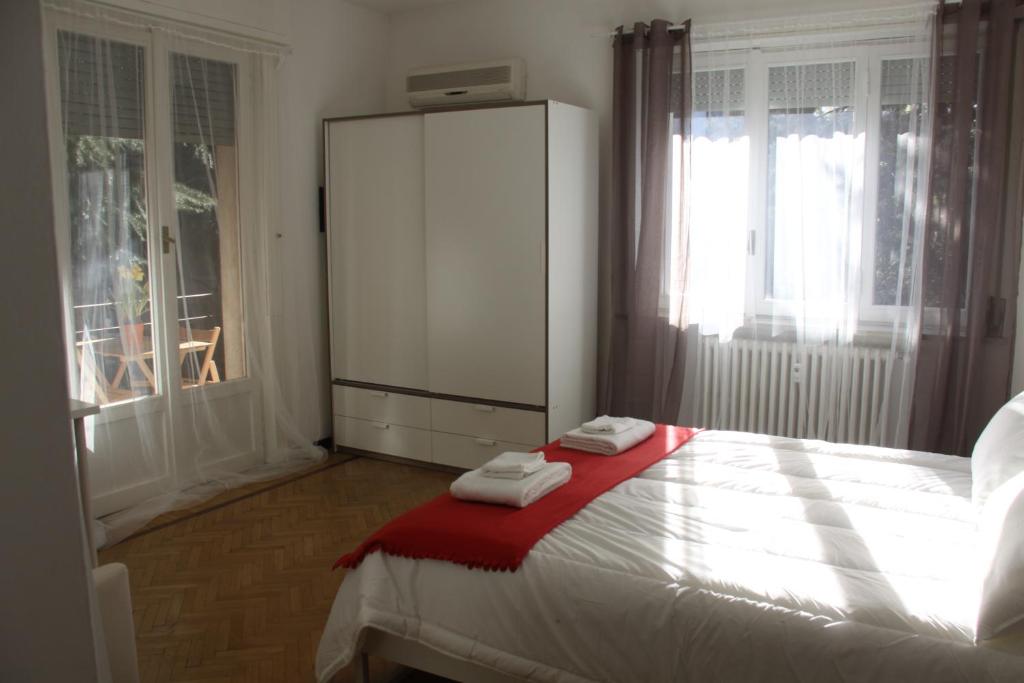 Postel nebo postele na pokoji v ubytování Lotus B&B