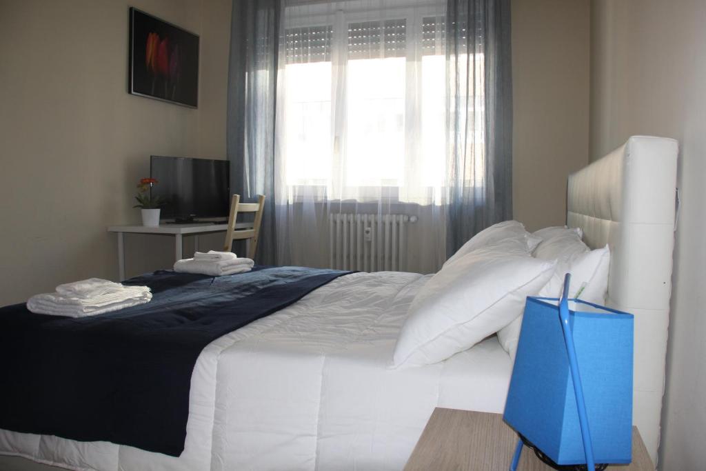 Postel nebo postele na pokoji v ubytování Lotus B&B