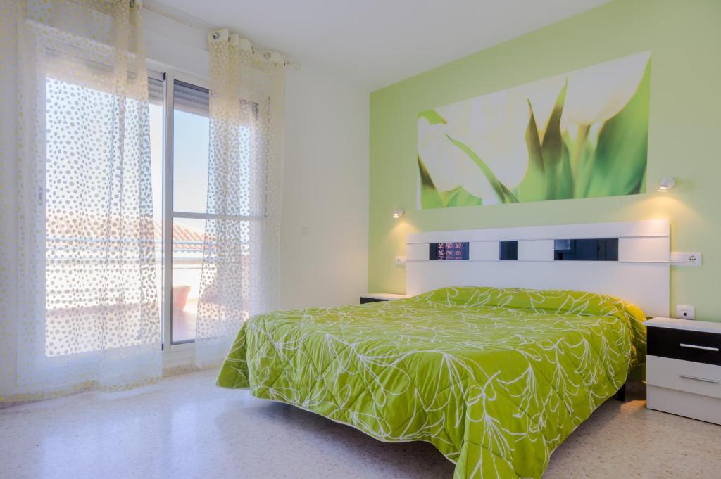 Posteľ alebo postele v izbe v ubytovaní Apartamentos Sanlúcar & Doñana