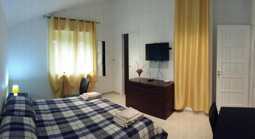 A bed or beds in a room at B&B Pian del Lago