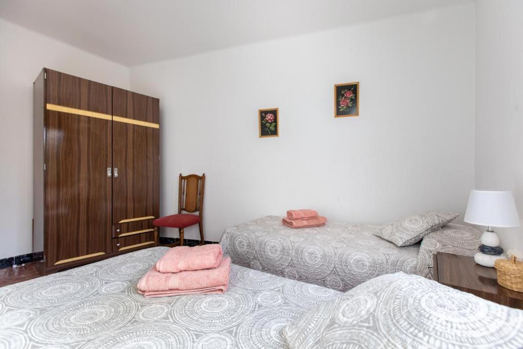 Postel nebo postele na pokoji v ubytování Casa turística Cunit