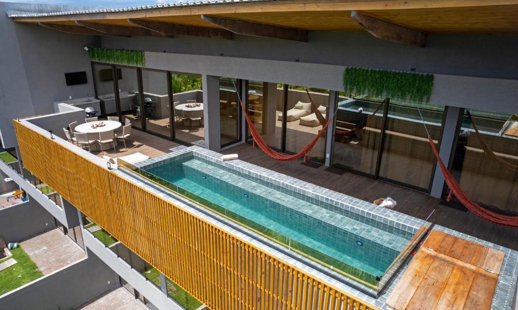 an overhead view of a swimming pool on a house at Kanui Garden Milagres in São Miguel dos Milagres