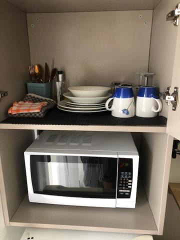 Kuchyň nebo kuchyňský kout v ubytování Coachman Motel