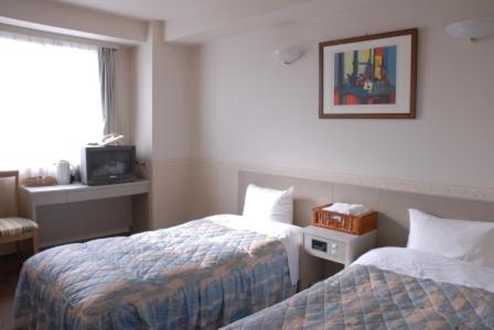 En eller flere senger på et rom på Hotel Hinodeya
