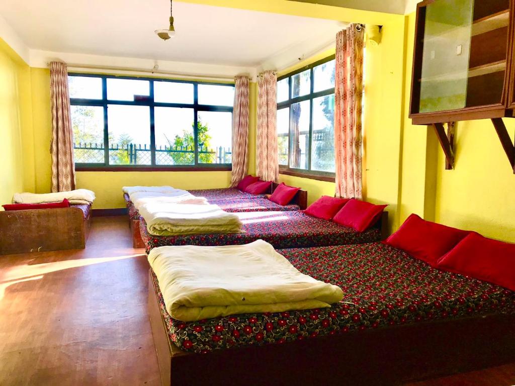 Postel nebo postele na pokoji v ubytování Hotel New Dragon