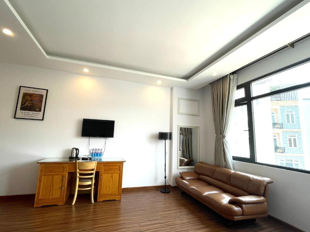 TV a/nebo společenská místnost v ubytování Tuan Long Da Lat Hostel