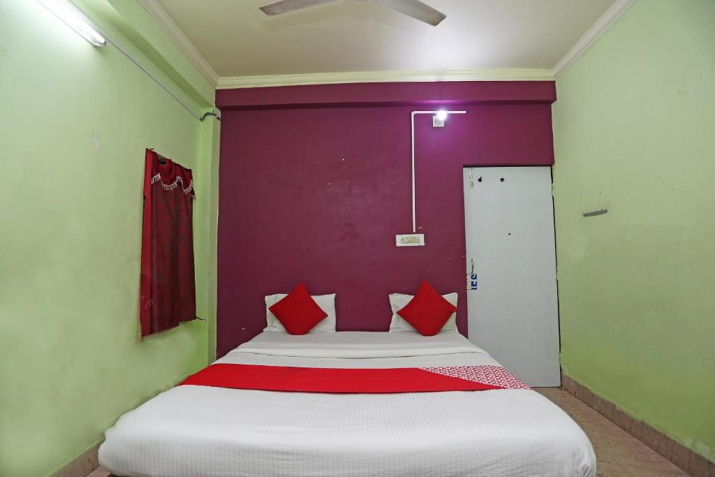 Postel nebo postele na pokoji v ubytování Hotel O Ma Guest House