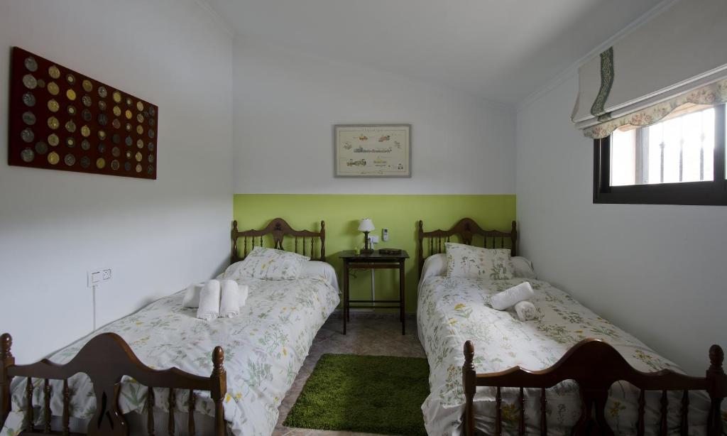 A bed or beds in a room at Villa Frasquita