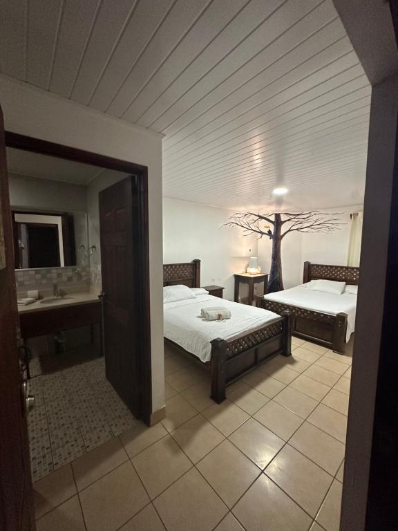 Hotel Pacande B&Bにあるベッド