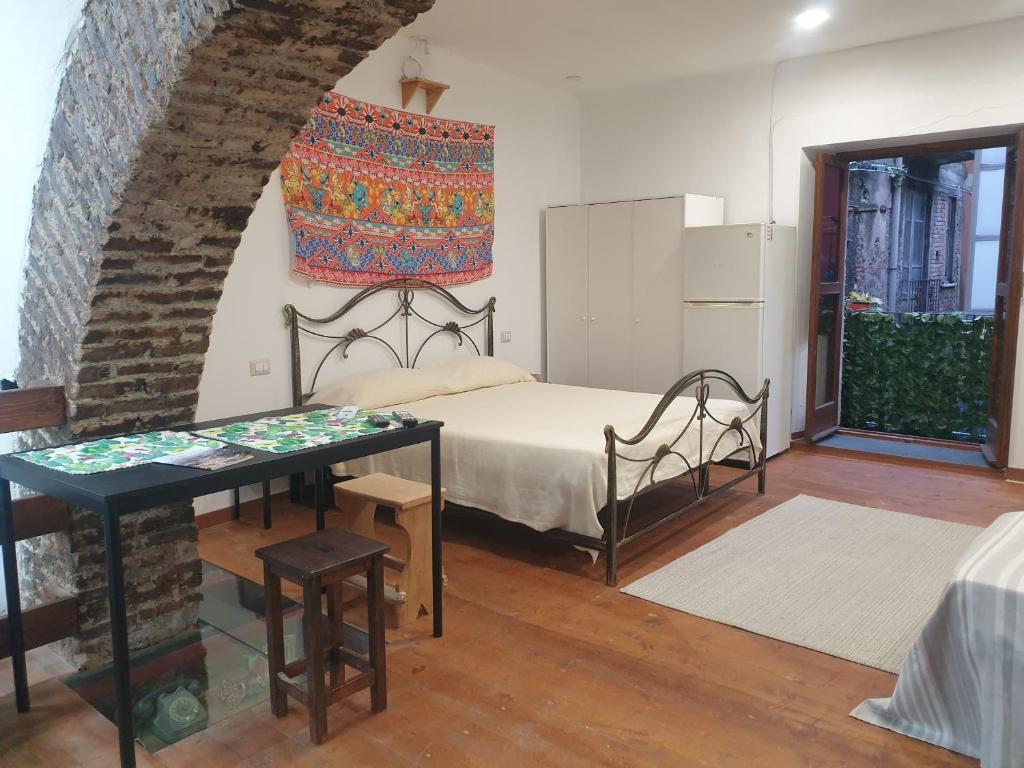 A bed or beds in a room at Sicily House Soprano