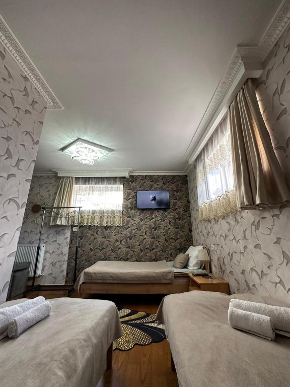 Postel nebo postele na pokoji v ubytování Guest House Elguja Qushashvili