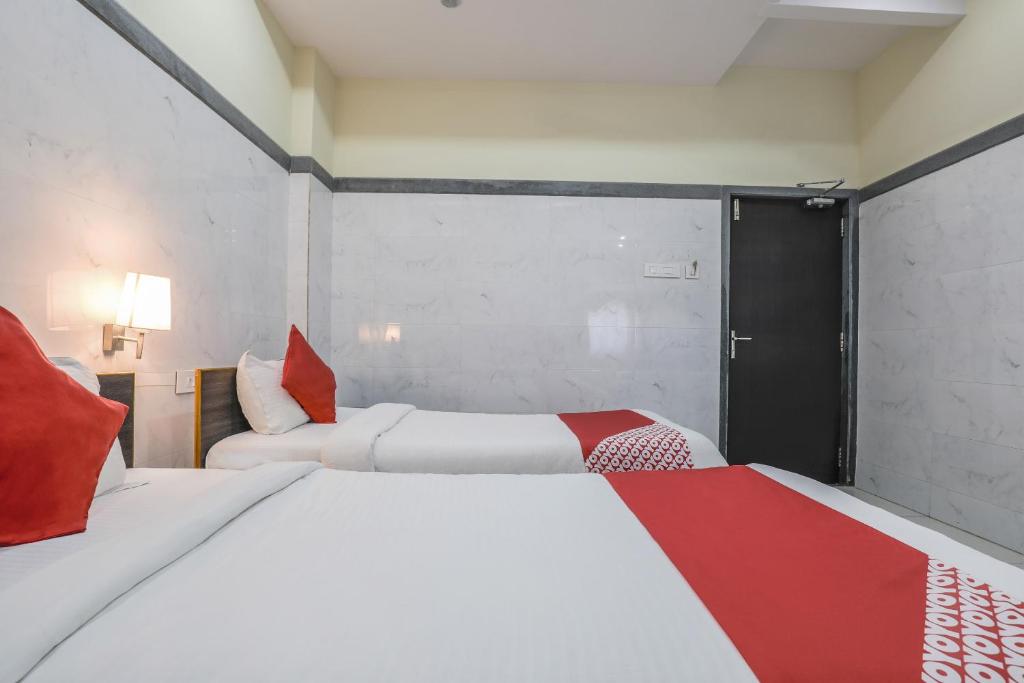 Postel nebo postele na pokoji v ubytování Super Hotel O Src Grand