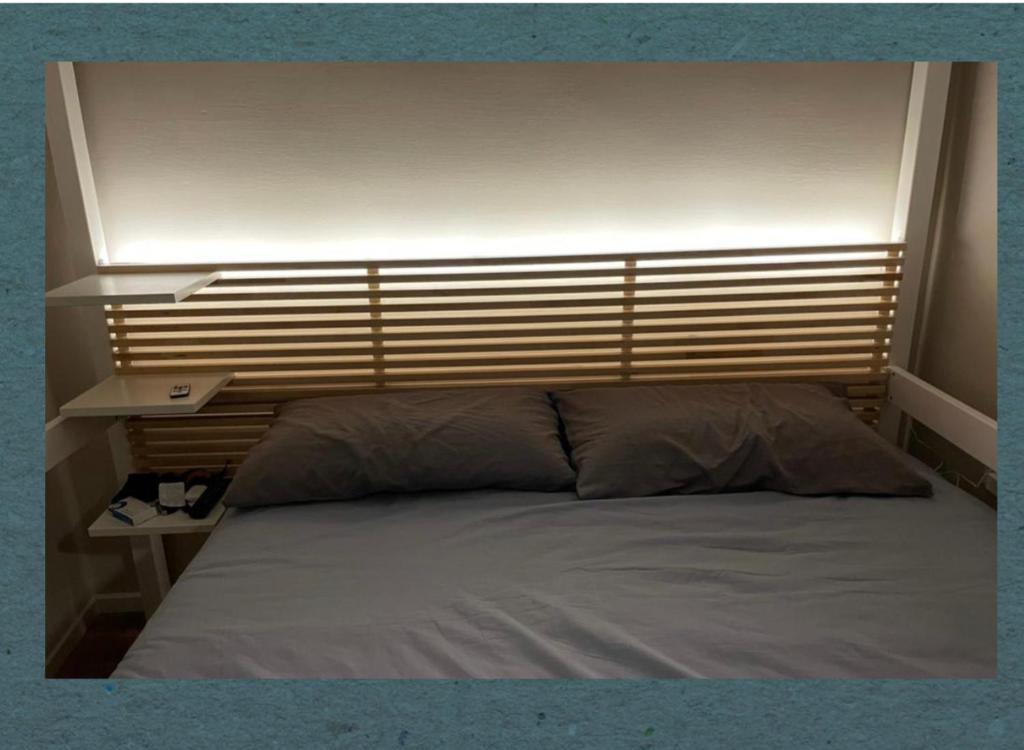 Кровать или кровати в номере LePetit