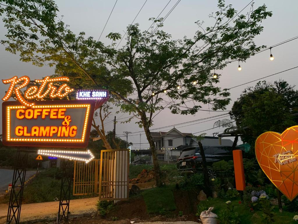 a sign for a coffee drinking establishment with a heart at Retro Khe Sanh in Lao Bao