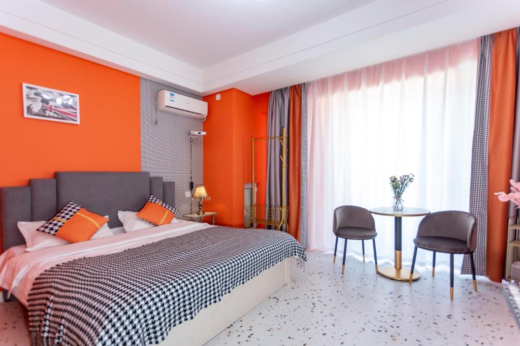 Postel nebo postele na pokoji v ubytování Dalian Hong Xi Yuan Apartment Wanda Plaza