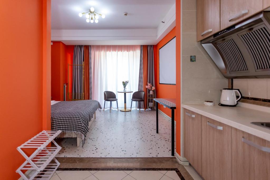 Posezení v ubytování Dalian Hong Xi Yuan Apartment Wanda Plaza
