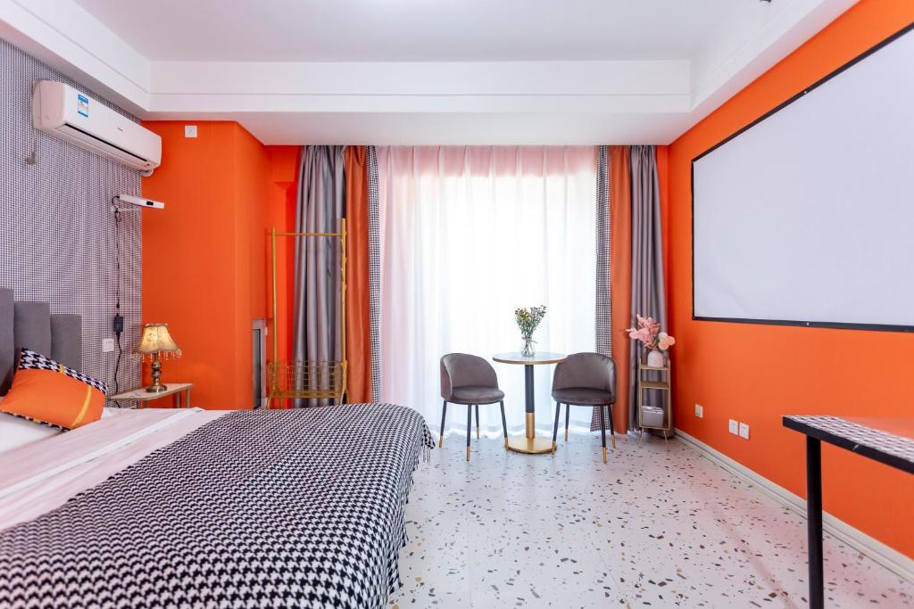 Postel nebo postele na pokoji v ubytování Dalian Hong Xi Yuan Apartment Wanda Plaza