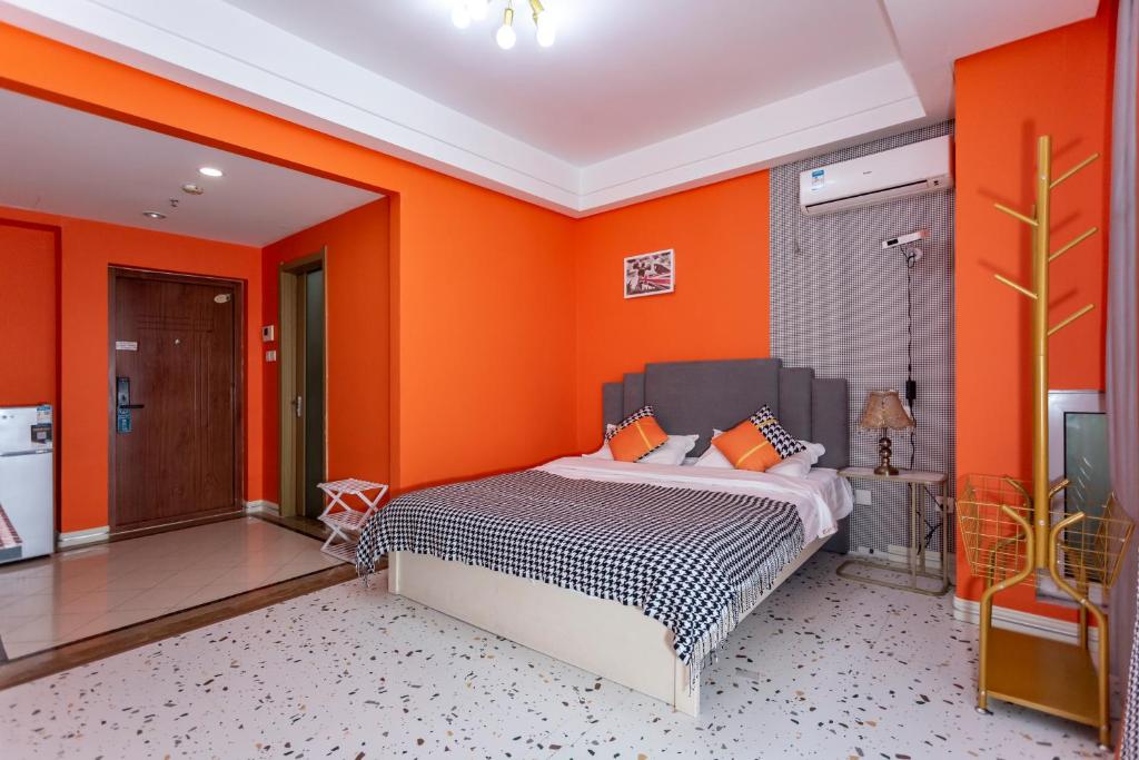 Postel nebo postele na pokoji v ubytování Dalian Hong Xi Yuan Apartment Wanda Plaza