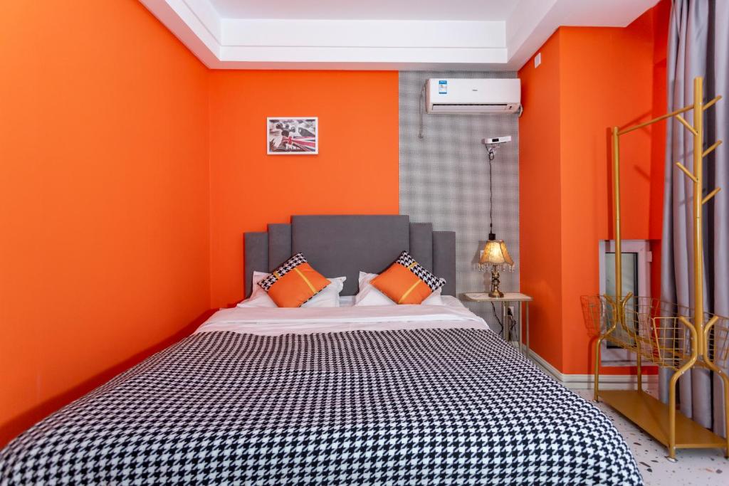 Postel nebo postele na pokoji v ubytování Dalian Hong Xi Yuan Apartment Wanda Plaza