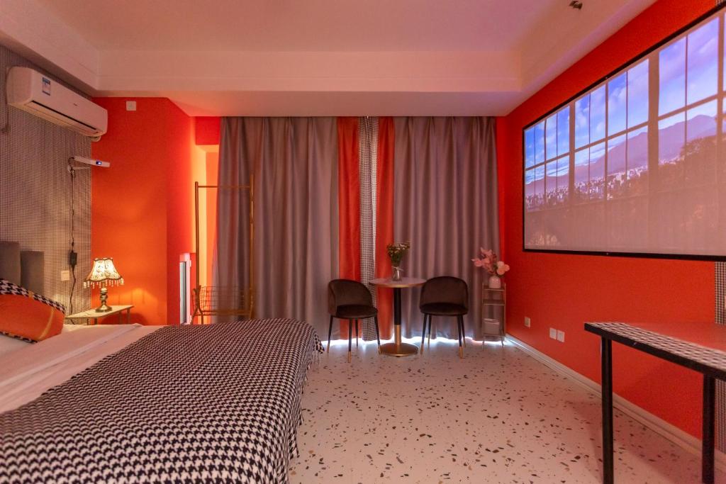 Postel nebo postele na pokoji v ubytování Dalian Hong Xi Yuan Apartment Wanda Plaza