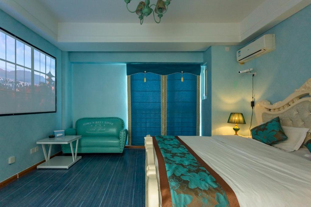 Postel nebo postele na pokoji v ubytování Dalian Hong Xi Yuan Apartment Wanda Plaza