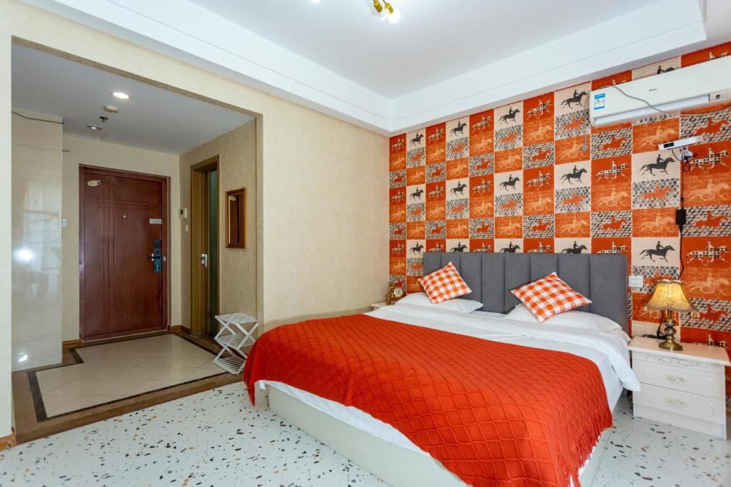 Postel nebo postele na pokoji v ubytování Dalian Hong Xi Yuan Apartment Wanda Plaza